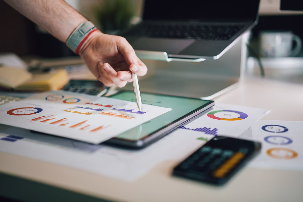 Financial graphs on desk with charts